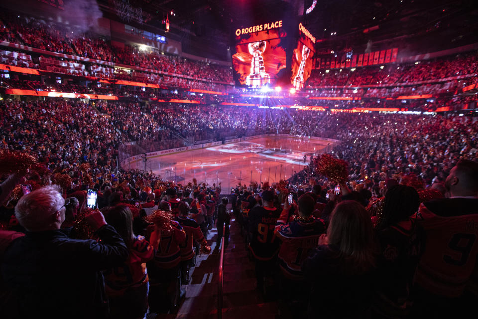 Fans cheer during the opening ceremony before the Los Angeles Kings take on the Edmonton Oilers in Game 1 of an NHL hockey Stanley Cup first-round playoff series, Monday, May 2, 2022 in Edmonton, Alberta. (Jason Franson/The Canadian Press via AP)