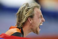 Winner Michel Mulder of the Netherlands celebrates during the men's 500 metres speed skating race at the Adler Arena during the 2014 Sochi Winter Olympics February 10, 2014. REUTERS/Issei Kato (RUSSIA - Tags: OLYMPICS SPORT SPEED SKATING TPX IMAGES OF THE DAY)