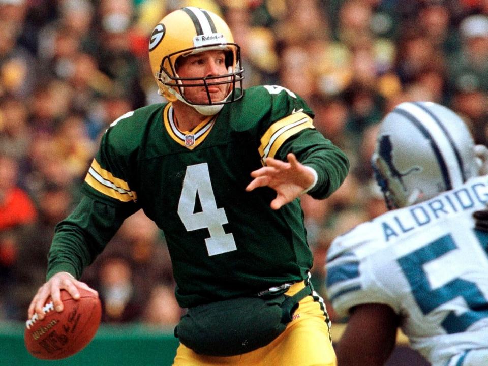 Brett Favre drops back to pass against the Detroit Lions.