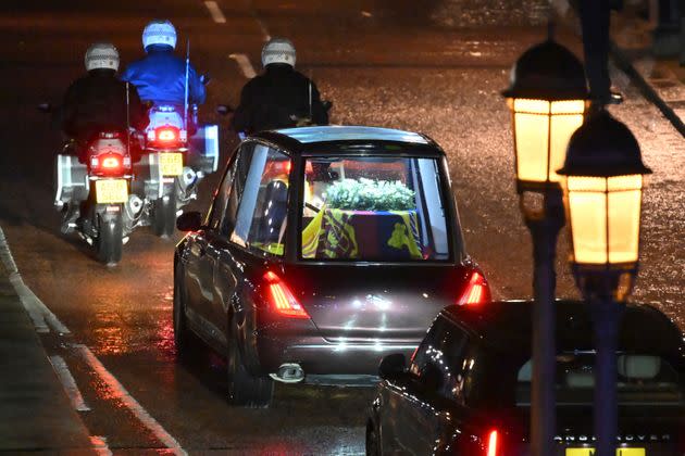 The coffin of Queen Elizabeth II in the royal hearse travels to the palace. (Photo: Marco Bertorello/Pool via AP)