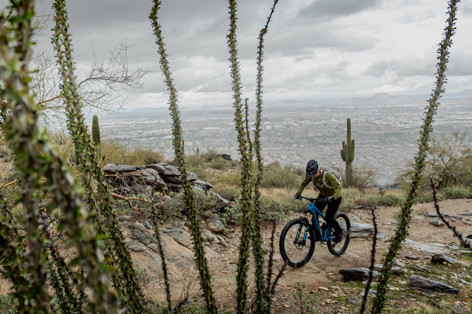 Rider climbing hill on Pivot Switchblade