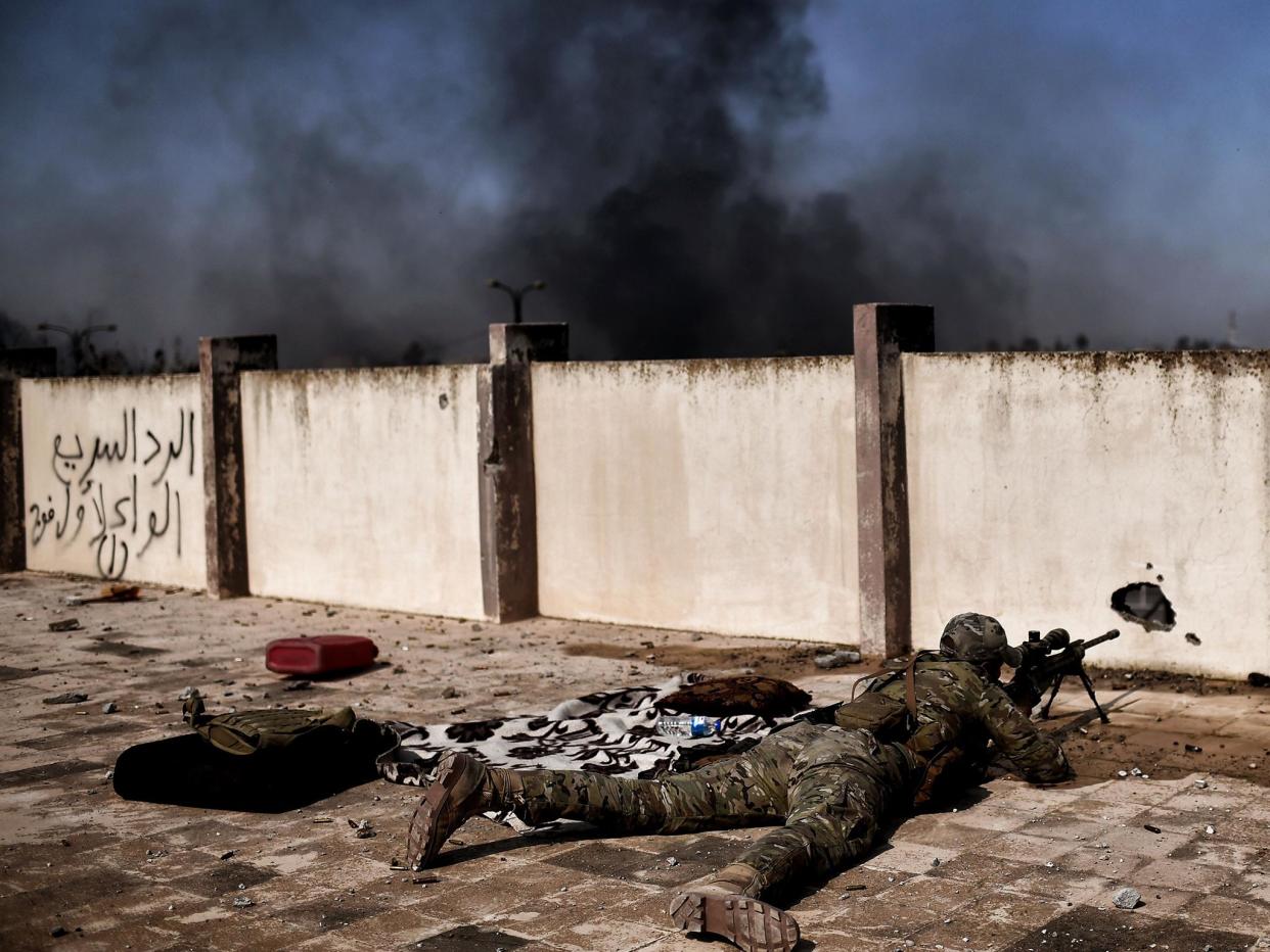 A sniper fires at targets during clashes with Islamic State group fighters in Mosul (file photo): ARIS MESSINIS/AFP/Getty Images