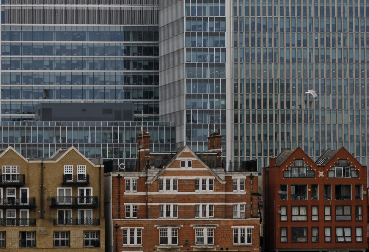 mortgage  Apartment buildings are backdropped by skyscrapers of banks at Canary Wharf in London, Britain October 30, 2015. Picture taken October 30, 2015.  REUTERS/Reinhard Krause