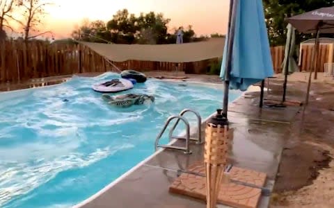 Waves in a swimming pool are pictured during the earthquake in Ridgecrest - Credit: TWITTER @RYLXAN