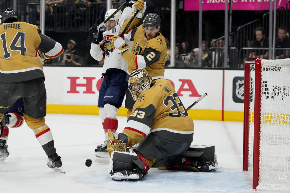 Vegas Golden Knights goaltender Adin Hill (33) stops a shot on goal against the Florida Panthers during the first period of Game 2 of the NHL hockey Stanley Cup Finals, Monday, June 5, 2023, in Las Vegas. (AP Photo/John Locher)