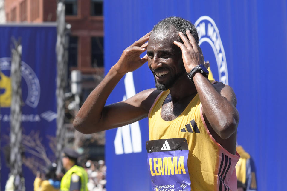 Sisay Lemma, of Ethiopia, celebrates after winning the Boston Marathon, Monday, April 15, 2024, in Boston. (AP Photo/Steven Senne)