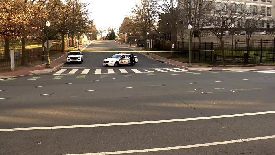 In this image taken from video, police are deployed outside the Israeli Embassy in Washington, Sunday, Feb. 25, 2024, after an active-duty member of the U.S. Air Force was critically injured after setting himself ablaze outside the diplomatic compound. (WJLA via AP)