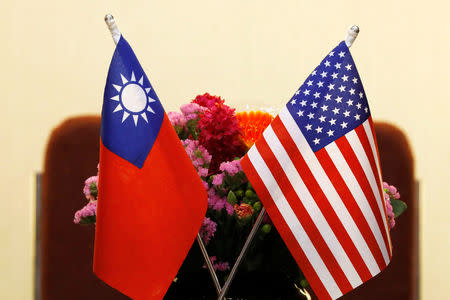 FILE PHOTO - Flags of Taiwan and U.S. are placed for a meeting between U.S. House Foreign Affairs Committee Chairman Ed Royce speaks and with Su Chia-chyuan, President of the Legislative Yuan in Taipei, Taiwan March 27, 2018. REUTERS/Tyrone Siu