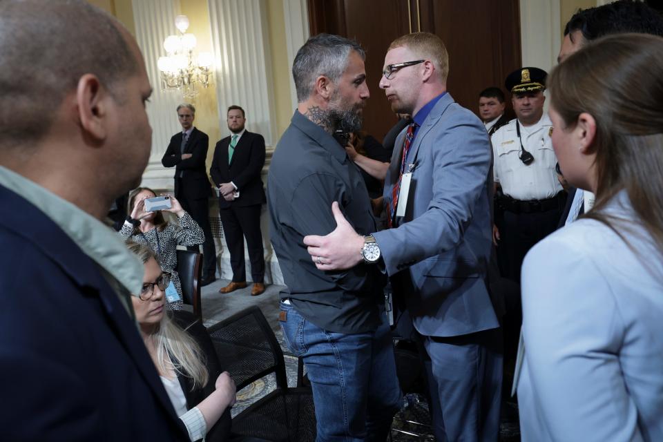 Stephen Ayres greets former Washington Metropolitan Police Officer Michael Fanone at a July hearing of the House Jan. 6 committee.