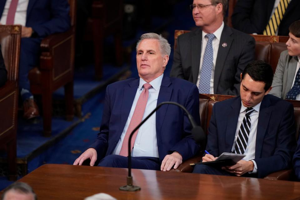 Rep. Kevin McCarthy of California listens as votes are cast for the next Speaker of the House during the opening day of the 118th Congress at the U.S. Capitol on Tuesday in Washington.