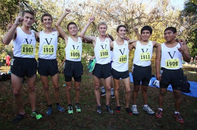 The Ventura High boys team pose together after winning the 2014 Division II title at the CIF State Cross Country Championships at Woodward Park in Fresno