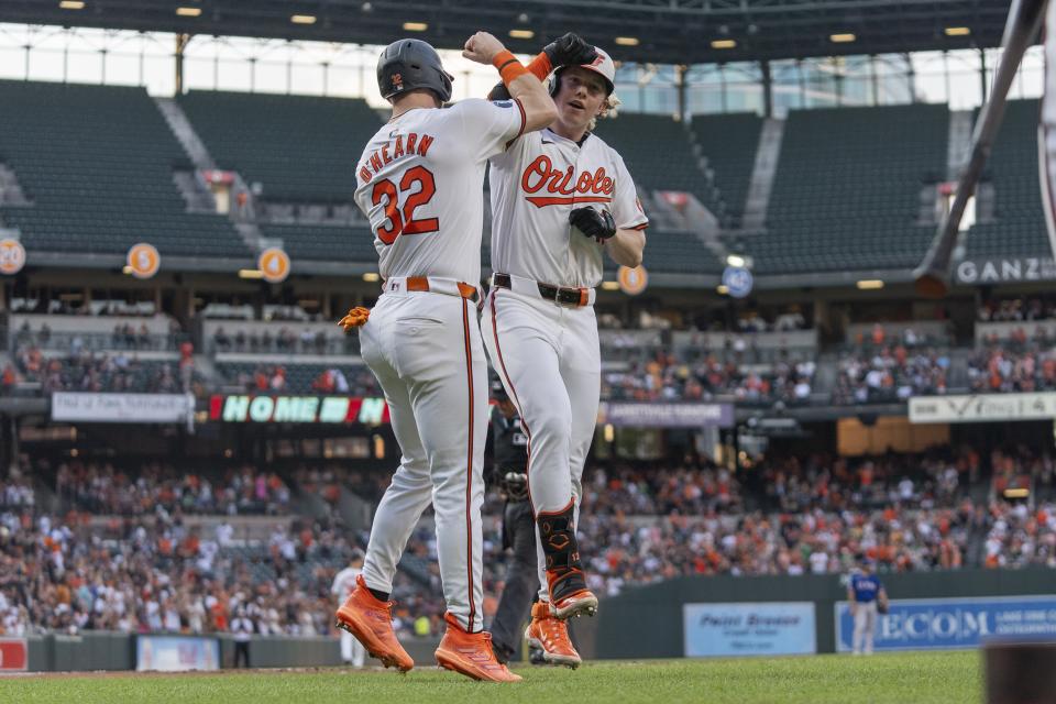 Baltimore Orioles' Heston Kjerstad, right, celebrates with Ryan O'Hearn (32) after hitting a two-run home run against the Texas Rangers during the third inning of a baseball game Thursday, June 27, 2024, in Baltimore. (AP Photo/Stephanie Scarbrough)