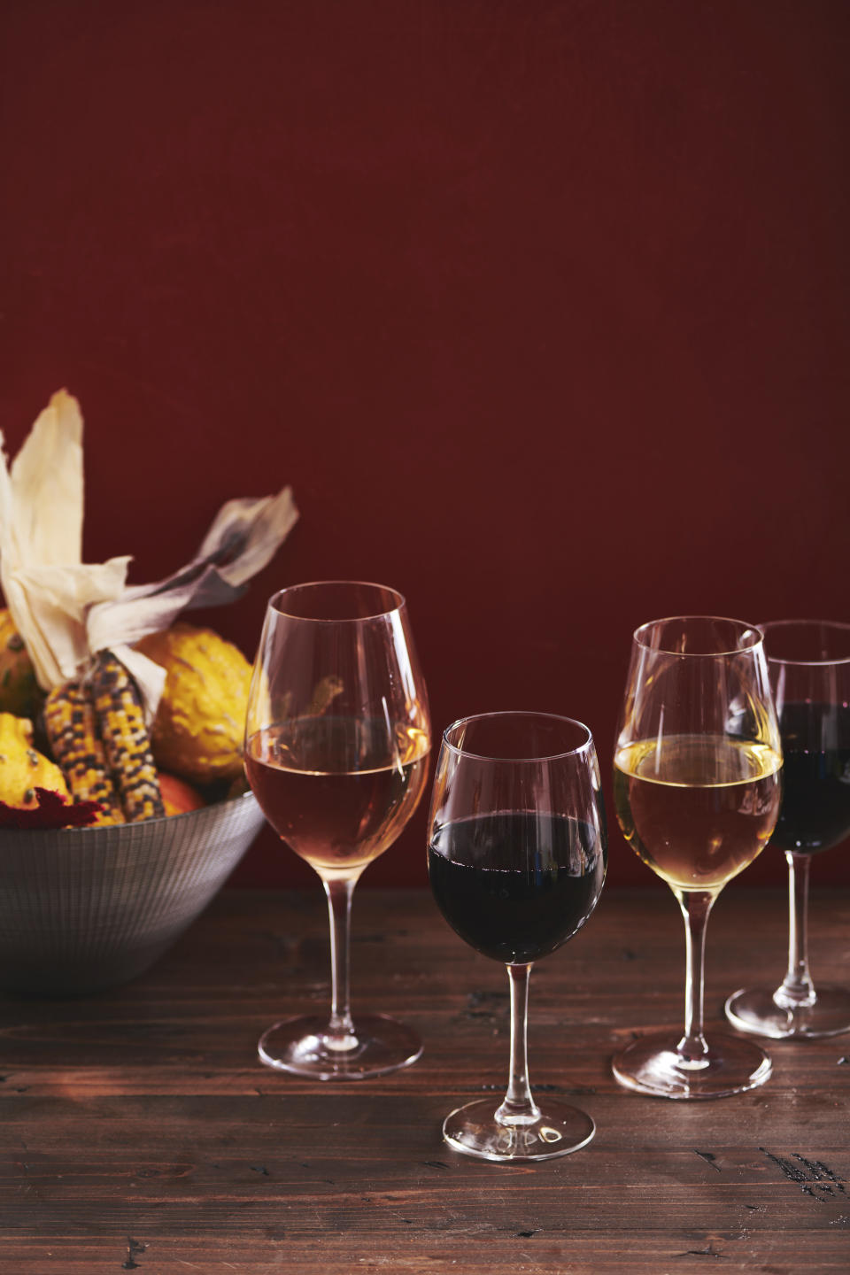 This November 2019 photo shows glasses of wine on a table in New York. There are plenty of good wines to choose from to accompany your Thanksgiving dinner, from Rieslings to Grenaches to Pinot Noirs. (Cheyenne Cohen/Katie Workman via AP)