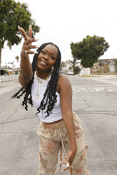 An animated GIF of Charm La'Donna, award winning choreographer just put out her first rap EP.