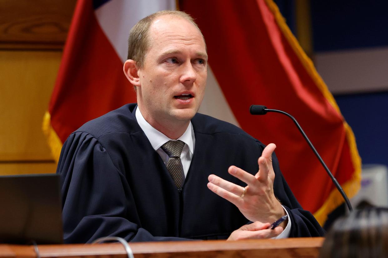 Fulton County Superior Judge Scott McAfee presides in court, Friday, March, 1, 2024, in Atlanta. The hearing is to determine whether Fulton County District Attorney Fani Willis should be removed from the case because of a relationship with Nathan Wade, special prosecutor she hired in the election interference case against former President Donald Trump. (AP Photo/Alex Slitz, Pool) ORG XMIT: GABA123