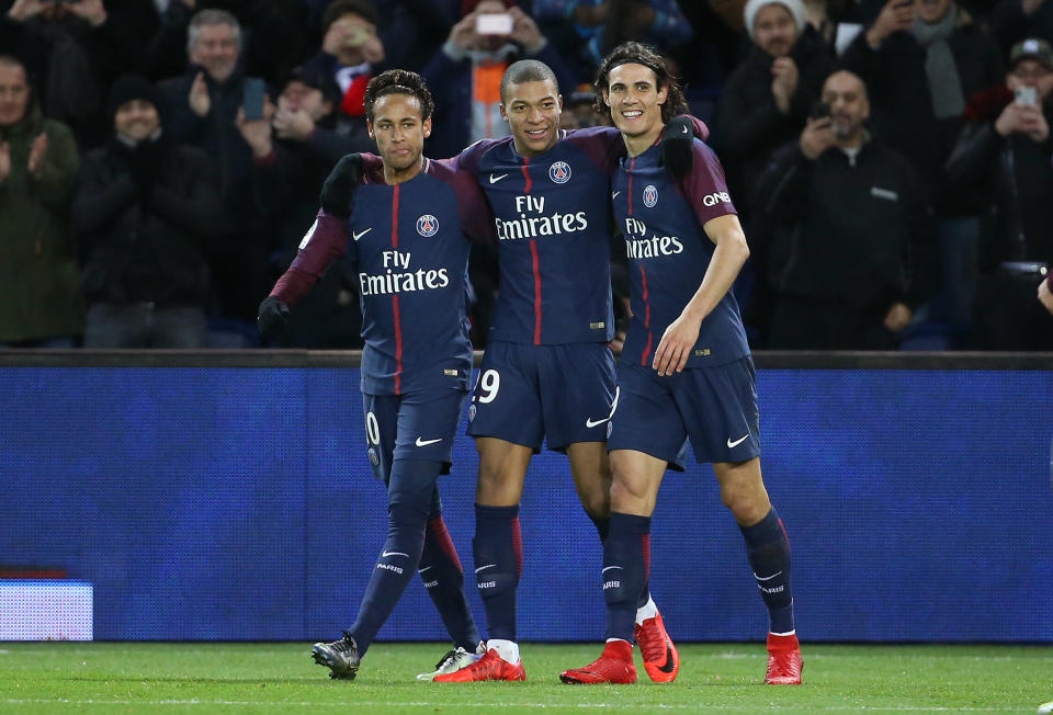 Neymar and Kylian Mbappe (left and center) cost PSG almost $500 million. (Getty)