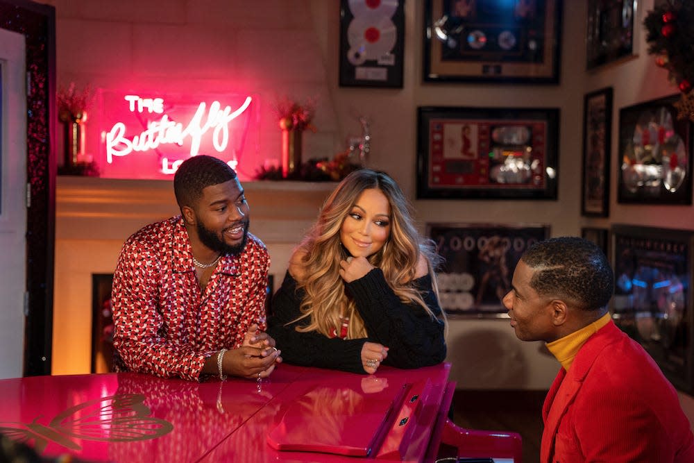 Mariah Carey, flanked by Khalid (left) and Kirk Franklin, offers new Christmas magic in 2021 with "Fall in Love at Christmas."