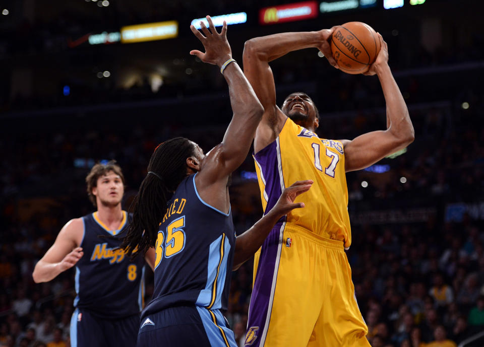 LOS ANGELES, CA - MAY 12: Andrew Bynum #17 of the Los Angeles Lakers shoots over Kenneth Faried #35 of the Denver Nuggets in the first quarter in Game Seven of the Western Conference Quarterfinals in the 2012 NBA Playoffs on May 12, 2012 at Staples Center in Los Angeles, California. NOTE TO USER: User expressly acknowledges and agrees that, by downloading and or using this photograph, User is consenting to the terms and conditions of the Getty Images License Agreement. (Photo by Harry How/Getty Images)