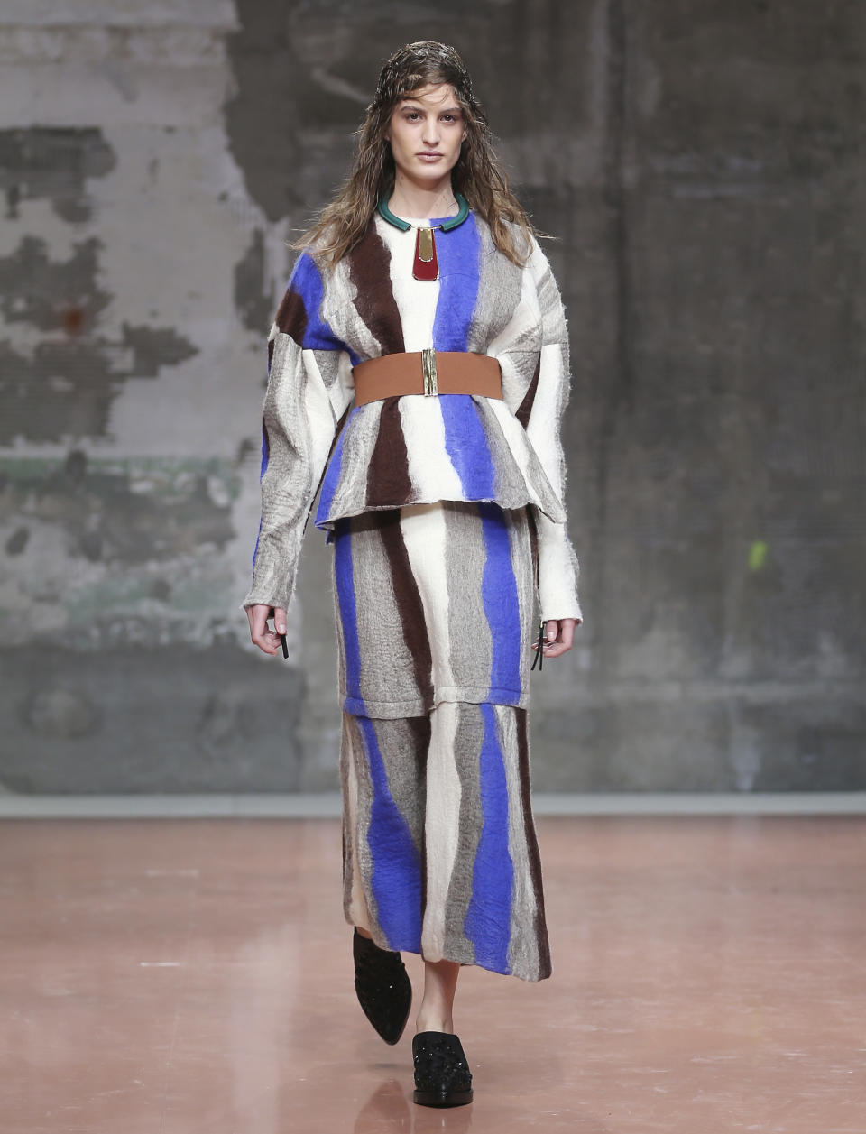 A model wears a creation for Marni women's Fall-Winter 2014-15 collection, part of the Milan Fashion Week, unveiled in Milan, Italy, Sunday, Feb. 23, 2014. (AP Photo/Antonio Calanni)