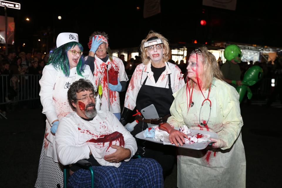 Locals attend the annual Halloween Parade in Market Square in Portsmouth on Monday, October 31, 2022.