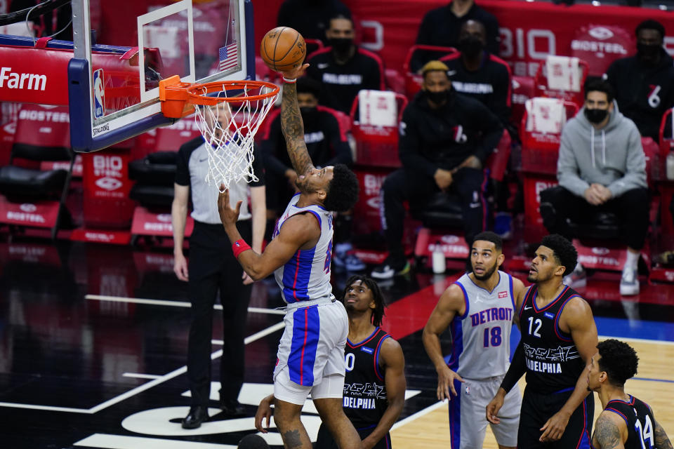 Detroit Pistons' Saddiq Bey, left, goes up for a shot past Philadelphia 76ers' Tyrese Maxey during the second half of an NBA basketball game, Saturday, May 8, 2021, in Philadelphia. (AP Photo/Matt Slocum)