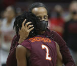 Virginia Tech's Aisha Sheppard (2) and head coach Kenny Brooks celebrate after an NCAA college basketball game against North Carolina State in Blacksburg, Va., Thursday, Jan. 28, 2021. (Matt Gentry/The Roanoke Times via AP, Pool)