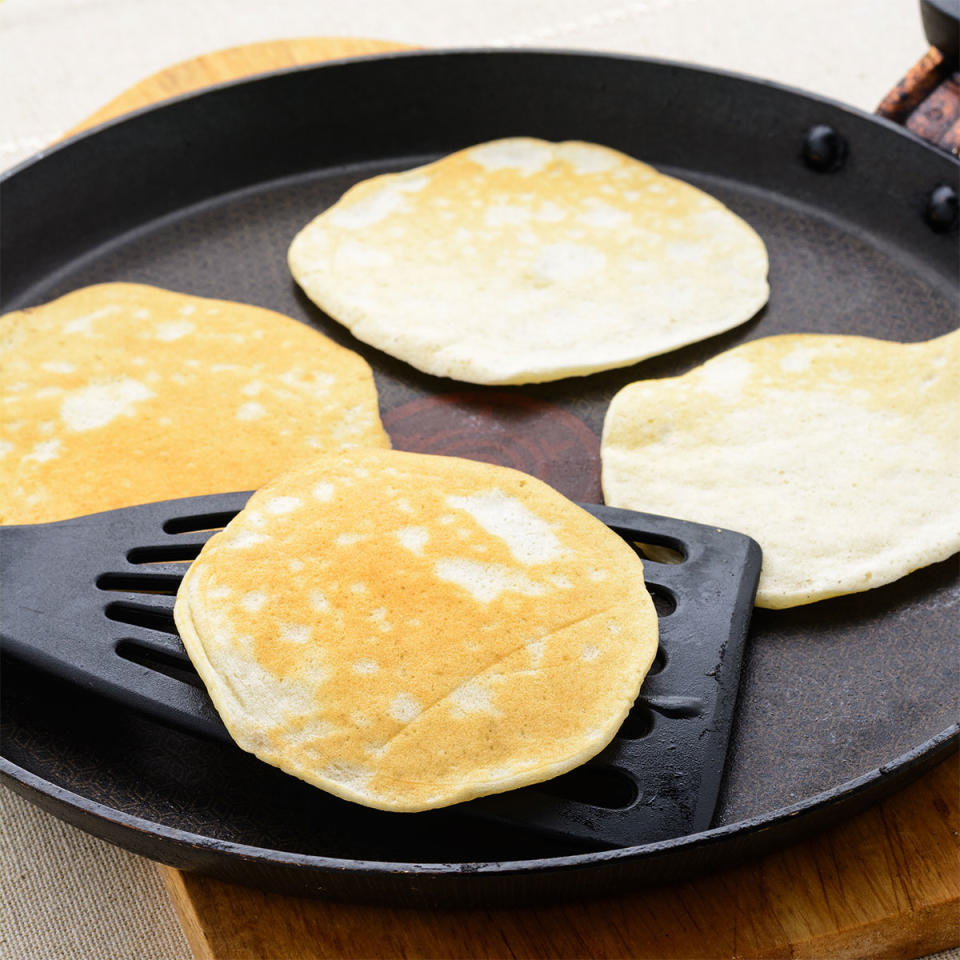 Flipping pancakes on a griddle