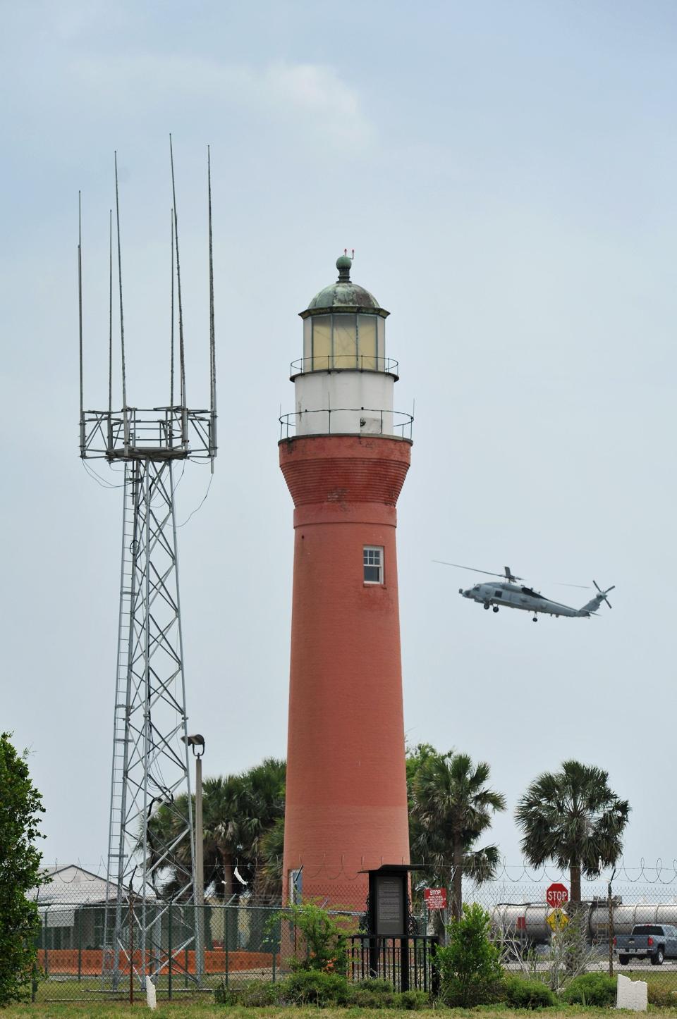 In this 2016 photo, a Navy helicopter flies past the 1858 Mayport lighthouse on the edge of old Mayport Village, just inside the boundaries of Naval Station Mayport.