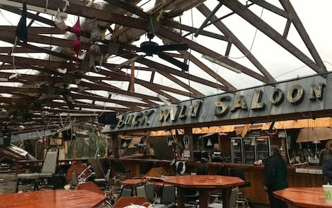 This photo shows some damage at the Buck Wild Saloon, located on U.S. Highway 280, east of Smiths Station, Alabama, - Credit: AP