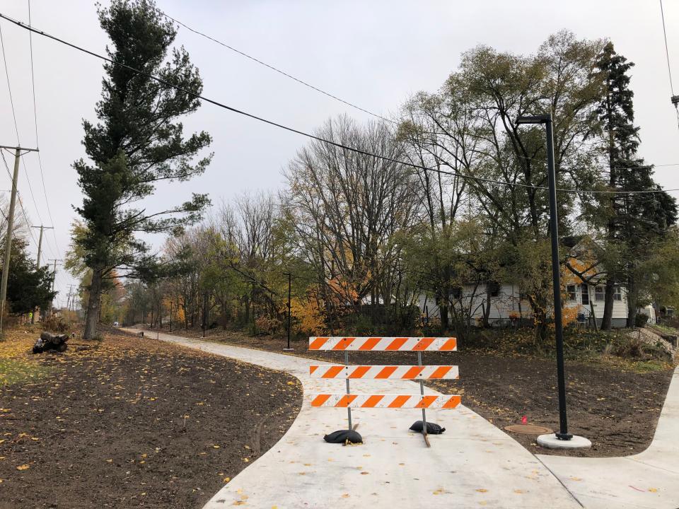 South Bend's Coal Line Trail heads east from the sidewalk along Van Buren Street and runs behind Holy Cross School, to the left. The trail hasn't been finished or opened yet.