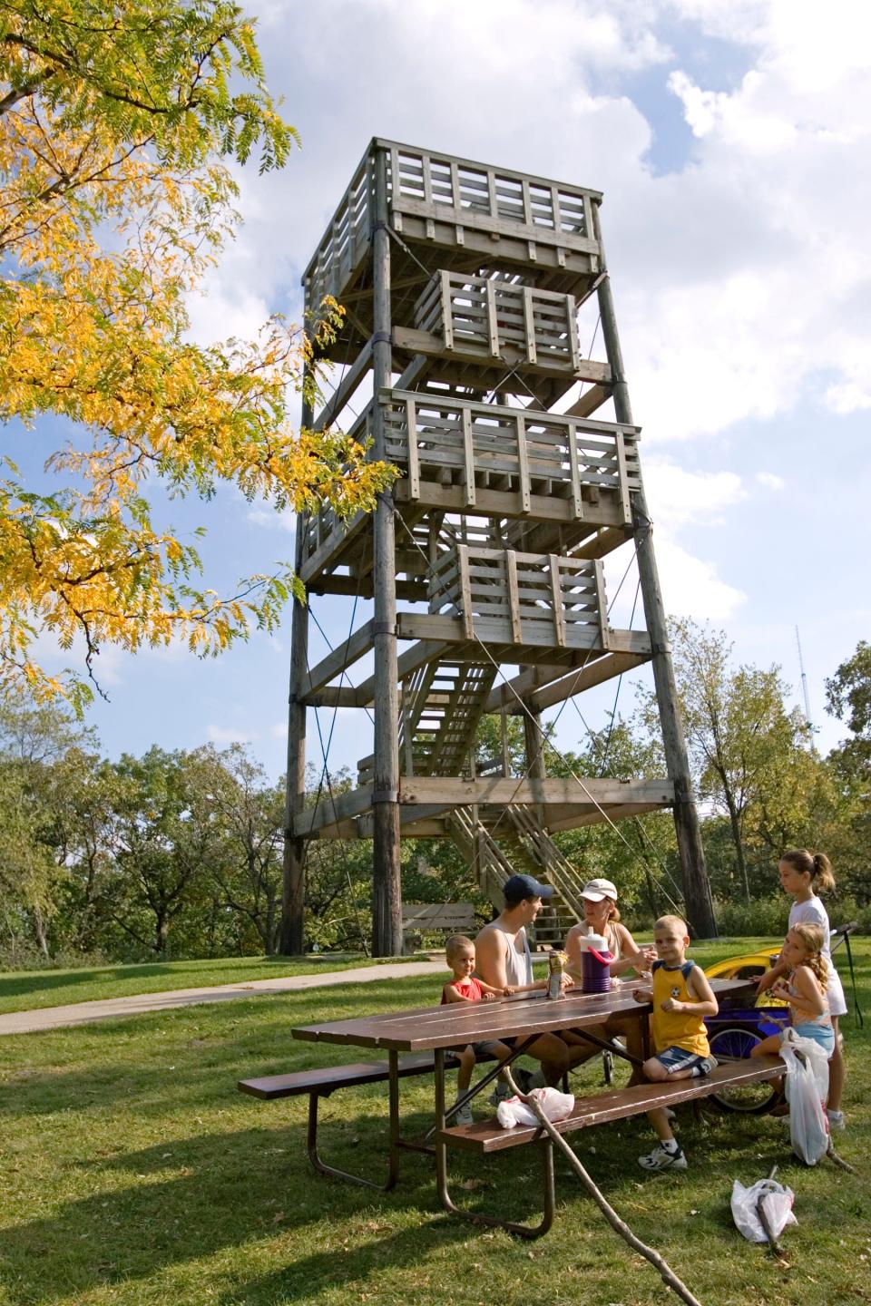 In this Journal Sentinel file photo, the Rosencrans family of Pewaukee enjoy a picnic beneath the observatory tower at Lapham Peak State Park. The park offers plenty of trails and the 45-foot tower as opportunities to seek out beautiful fall foliage.