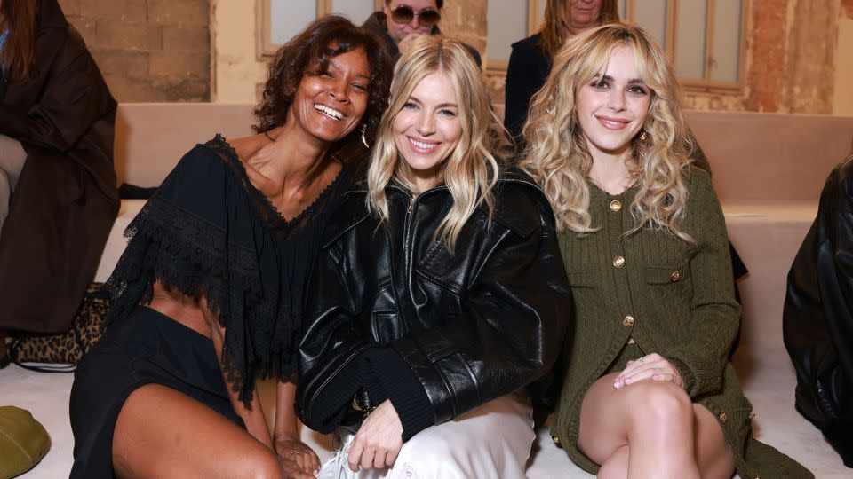 Actor Sienna Miller was front row at Chloe — alongside model Liya Kebede (on left) and actor Kiernan Shipka (on right)— to witness Chemena Kamali's debut at the house, and the return of Miller's once-signature "boho" style. - Arnold Jerocki/Getty Images