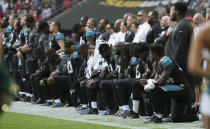 <p>Jacksonville Jaguars players kneel down during the playing of the U.S. national anthem before an NFL football game against the Baltimore Ravens at Wembley Stadium in London, Sunday Sept. 24, 2017. (AP Photo/Tim Ireland) </p>