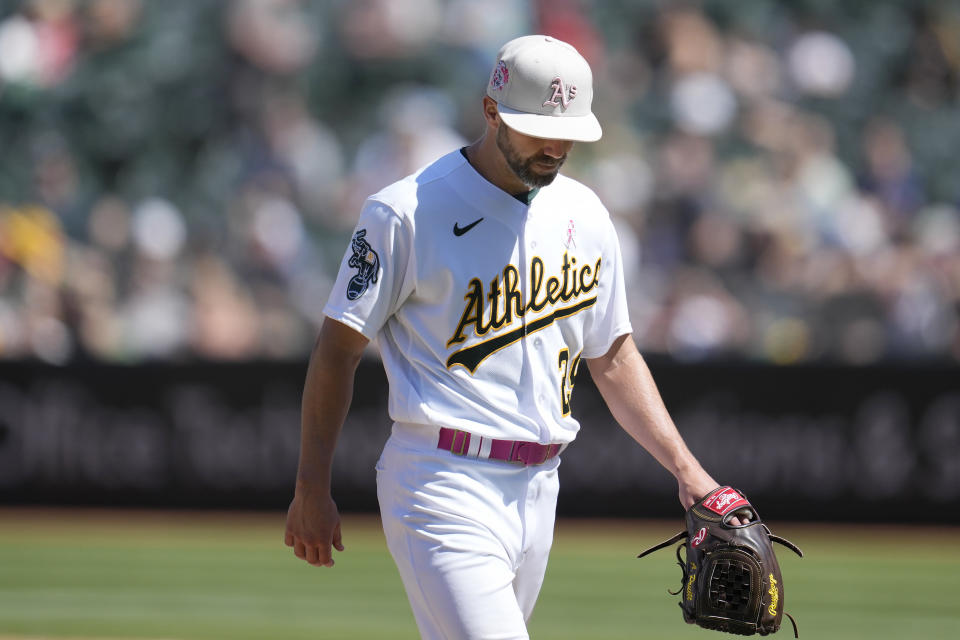 Oakland Athletics pitcher Austin Pruitt walks toward the dugout after being relieved during the eighth inning of a baseball game against the Texas Rangers in Oakland, Calif., Sunday, May 14, 2023. (AP Photo/Jeff Chiu)