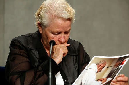 Roselyne Hamel (L) sister of Father Jacques Hamel holds a picture during a media conference at the Vatican, September 14, 2016. REUTERS/Stefano Rellandini