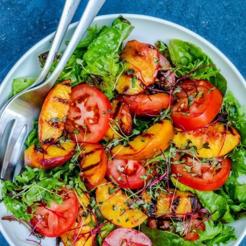 <p>This Healthy Table</p><p>If you are firing up the grill anyway, why not use it for the salad too? Bursting with flavor and summer colors.</p><p><strong>Get the recipe:</strong><strong> <a href="https://thishealthytable.com/blog/grilled-peach-tomato-salad/" rel="nofollow noopener" target="_blank" data-ylk="slk:Grilled Peach and Tomato Salad;elm:context_link;itc:0;sec:content-canvas" class="link ">Grilled Peach and Tomato Salad</a></strong></p><p><strong>Related: <a href="https://www.yahoo.com/lifestyle/37-perfect-peach-recipes-summer-135909747.html" data-ylk="slk:35 Perfect Peach Recipes For Summer;elm:context_link;itc:0;sec:content-canvas;outcm:mb_qualified_link;_E:mb_qualified_link;ct:story;" class="link  yahoo-link">35 Perfect Peach Recipes For Summer</a></strong></p>