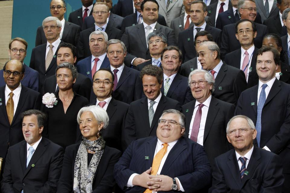 Leaders pose for a G-20 finance ministers and central bank governors group photo after their meeting at the IMF and World Bank Group Spring Meetings in Washington, Friday, April 20, 2012. Among those pictured are, first row, left to right: Mexico's finance minister Jose Antonio Meade; IMF managing director Christine Lagarde; Mexico's central bank governor Agustin Carstens; German Finance Minister Wolfgang Schaeuble. Second row, from left to right: International Monetary and Financial Committee (IMFC) chairman Tharman Shanmugaratnam; Danish economic affairs minister Margrethe Vestager; South Korean Finance Minister Bahk Jae-wan; Treasury Secretary Tim Geithner; Bank of England Governor Mervyn King; British Chancellor of the Exchequer George Osborne. Also pictured on the third row, Germany Bundesbank president Jens Weidmann, far left; Turkish Deputy Prime Minister for Economy Ali Babacan, second left; Canadian Finance Minister James Flaherty, fourth left. (AP Photo/Charles Dharapak)