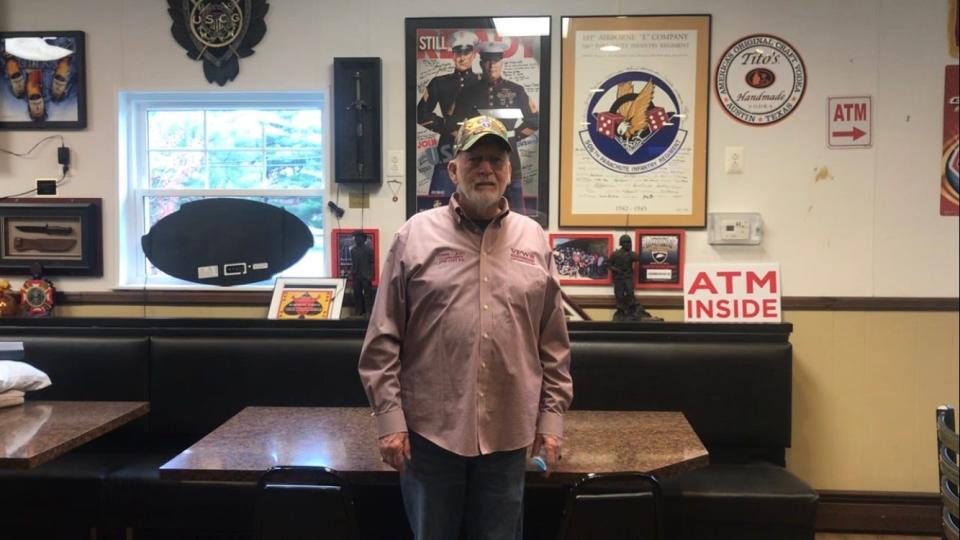 Dennis Cleary, commander of Veterans of Foreign Wars Post 679 in Glassboro, stands Tuesday in front of military displays and memorabilia in its second floor bar. Hall rentals are important for the roughly 250-member post on Wilmer Street. PHOTO: April 2, 2024.