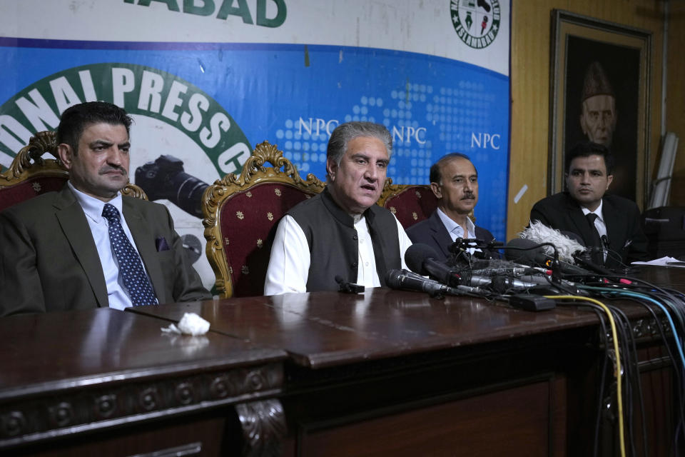 Shah Mahmood Qureshi, center, a top leader of Pakistan's former Prime Minister Imran Khan's 'Pakistan Tehreek-e-Insaf' party, gives a press conference with Khan's legal team regarding Khan's arrest and his cases, in Islamabad, Pakistan, Monday, Aug. 7, 2023. Khan is now an inmate at a high-security prison after being convicted of corruption and sentenced to three years. (AP Photo/Anjum Naveed)