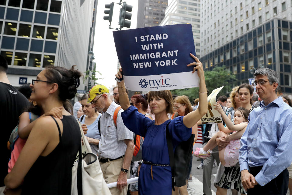 <p>Protesters carrying signs cross E. 42nd Street and head toward the United Nations in New York City on June 20, 2018. (Photo: Gordon Donovan/Yahoo News) </p>