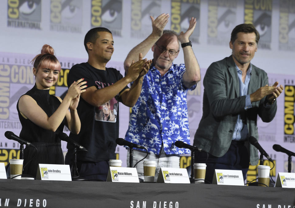 Maisie Williams, from left, Jacob Anderson, Liam Cunningham and Nikolaj Coster-Waldau clap at the conclusion of the "Game of Thrones" panel on day two of Comic-Con International on Friday, July 19, 2019, in San Diego. (Photo by Chris Pizzello/Invision/AP)