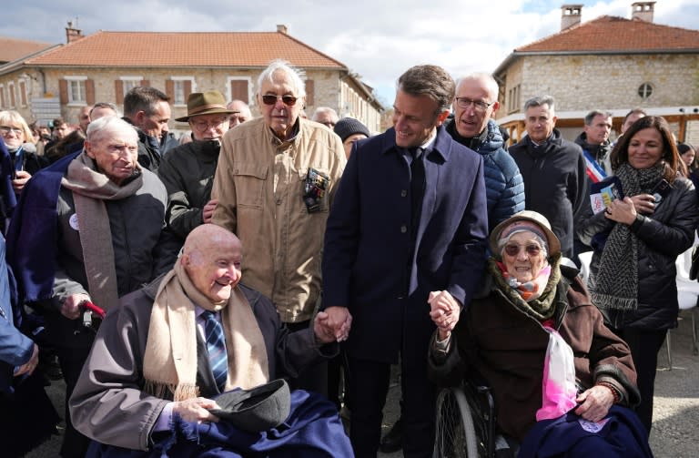 French President Emmanuel Macron meets 98-year-old former Resistance fighter Alphonse Taravello (left) and 99-year-old Yvonne Cheval (right), who lost part of her family during World War II (Laurent Cipriani)