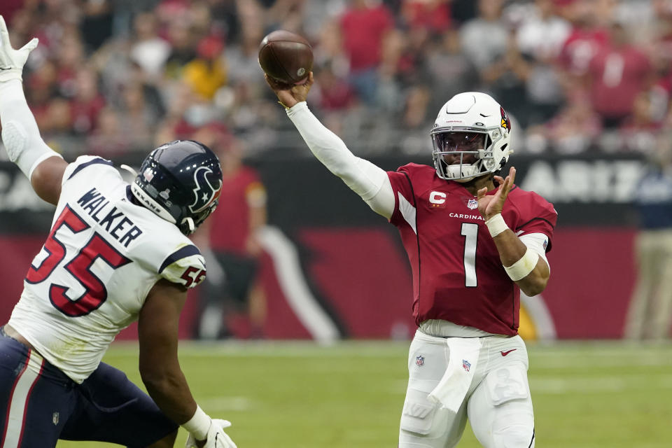 Arizona Cardinals quarterback Kyler Murray (1) throws over Houston Texans defensive end DeMarcus Walker (55) during the first half of an NFL football game, Sunday, Oct. 24, 2021, in Glendale, Ariz. (AP Photo/Darryl Webb)