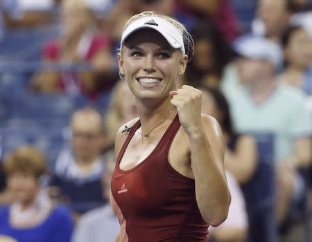 Caroline Wozniacki of Denmark celebrates her quarter-final win Wednesday. She gets Shuai Peng in Friday's semifinal. REUTERS/Shannon Stapleton