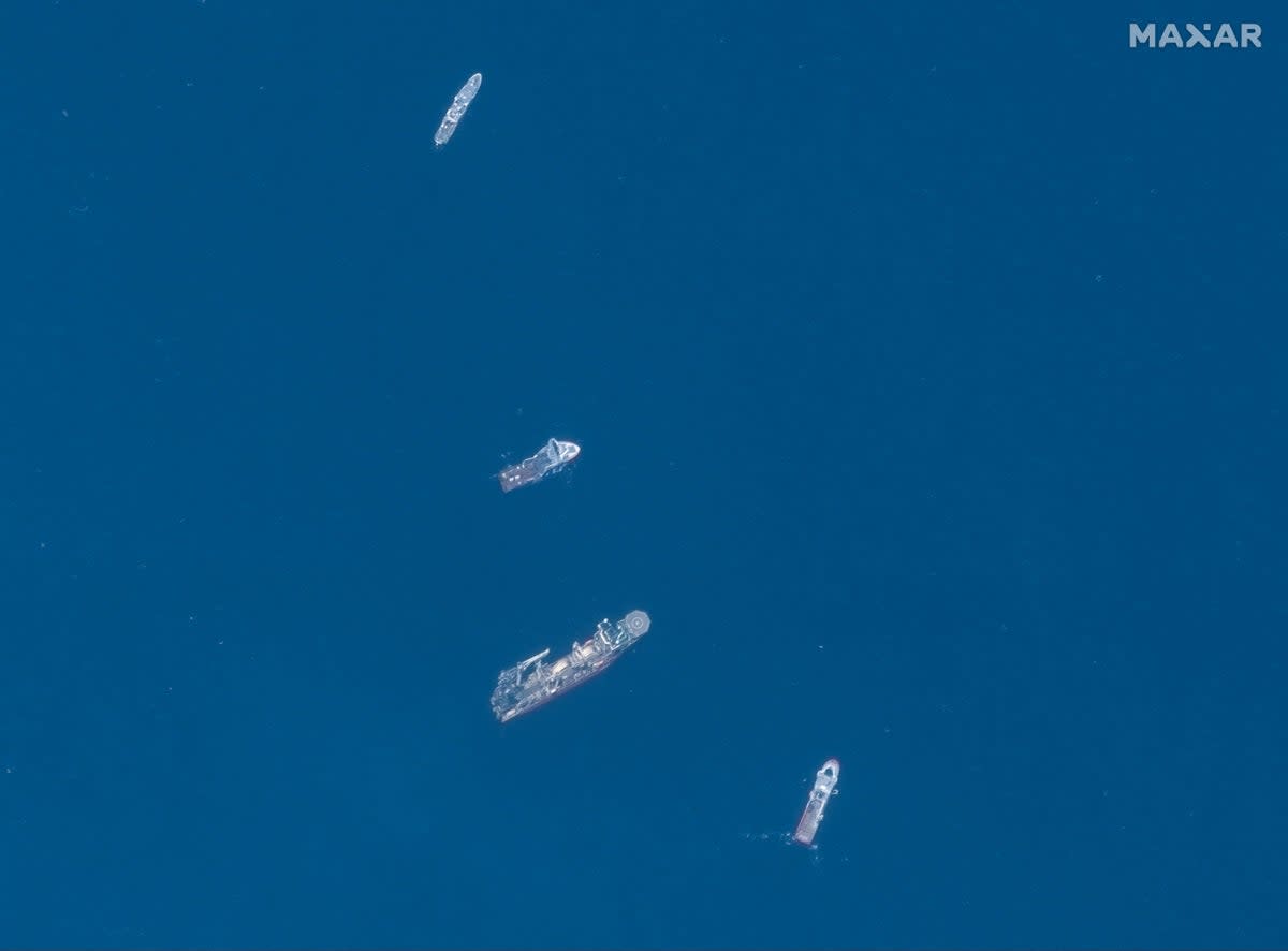 A satellite image shows ships taking part in the search and rescue operations associated with the missing Titan submersible near the wreck of the Titanic (Maxar Technologies/Handout via REUTERS)