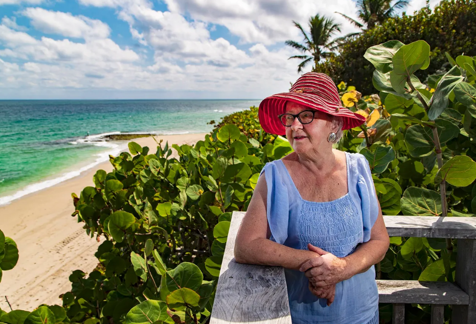 Lucia Milani gazes toward the Highland Beach beachfront in 2019. She has waited since 1987 for the county to build a county park on a beach parcel she and her late husband, Cam, sold to the county.