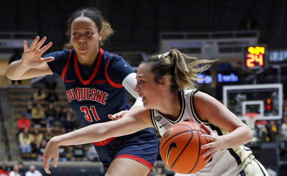 Duquesne Dukes forward Precious Johnson (31) defends Purdue Boilermakers guard Abbey Ellis (23) during the NCAA WNIT basketball game, Thursday, March 28, 2024, at Mackey Arena in West Lafayette, Ind.