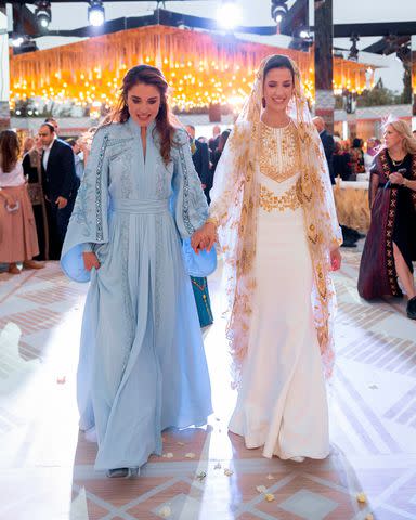 <p>Royal Hashemite Court/picture-alliance/dpa/AP Images</p> Queen Rania with Rajwa at dinner party prior to her wedding