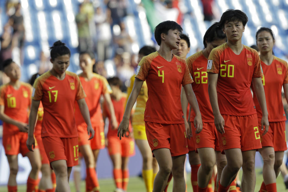 China players walk along the pitch at the end of the Women's World Cup round of 16 soccer match between Italy and China at Stade de la Mosson in Montpellier, France, Tuesday, June 25, 2019. Italy won 2-0. (AP Photo/Claude Paris)