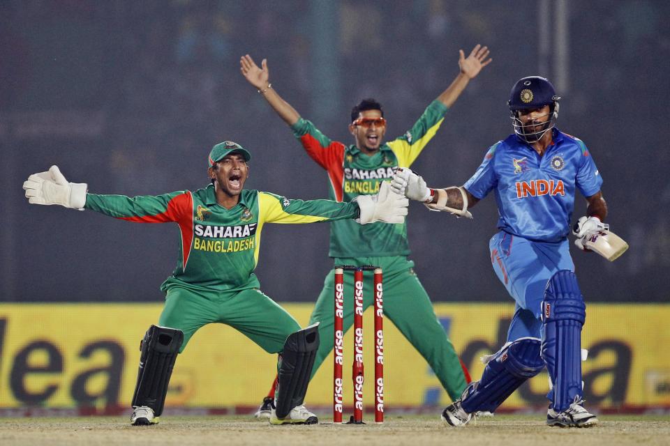 Bangladesh’s wicketkeeper Anamul Haque, left, and teammate Nasir Hossain appeal unsuccessfully for an LBW during the Asia Cup one-day international cricket tournament against India in Fatullah, near Dhaka, Bangladesh, Wednesday, Feb. 26, 2014. (AP Photo/A.M. Ahad)